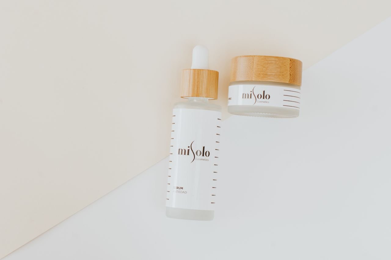 Crafting Captivating Headlines: Your awesome post title goes here Minimalist flat lay of skincare products with bamboo lids on a neutral background.
