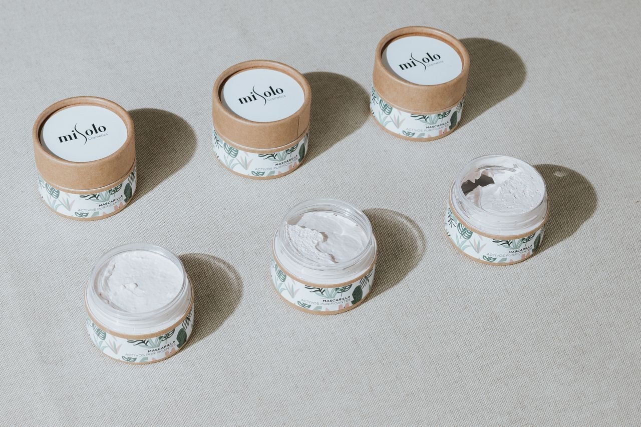 The Art of Drawing Readers In: Your attractive post title goes here Top view of natural skincare creams in eco-friendly packaging, promoting sustainability and beauty.